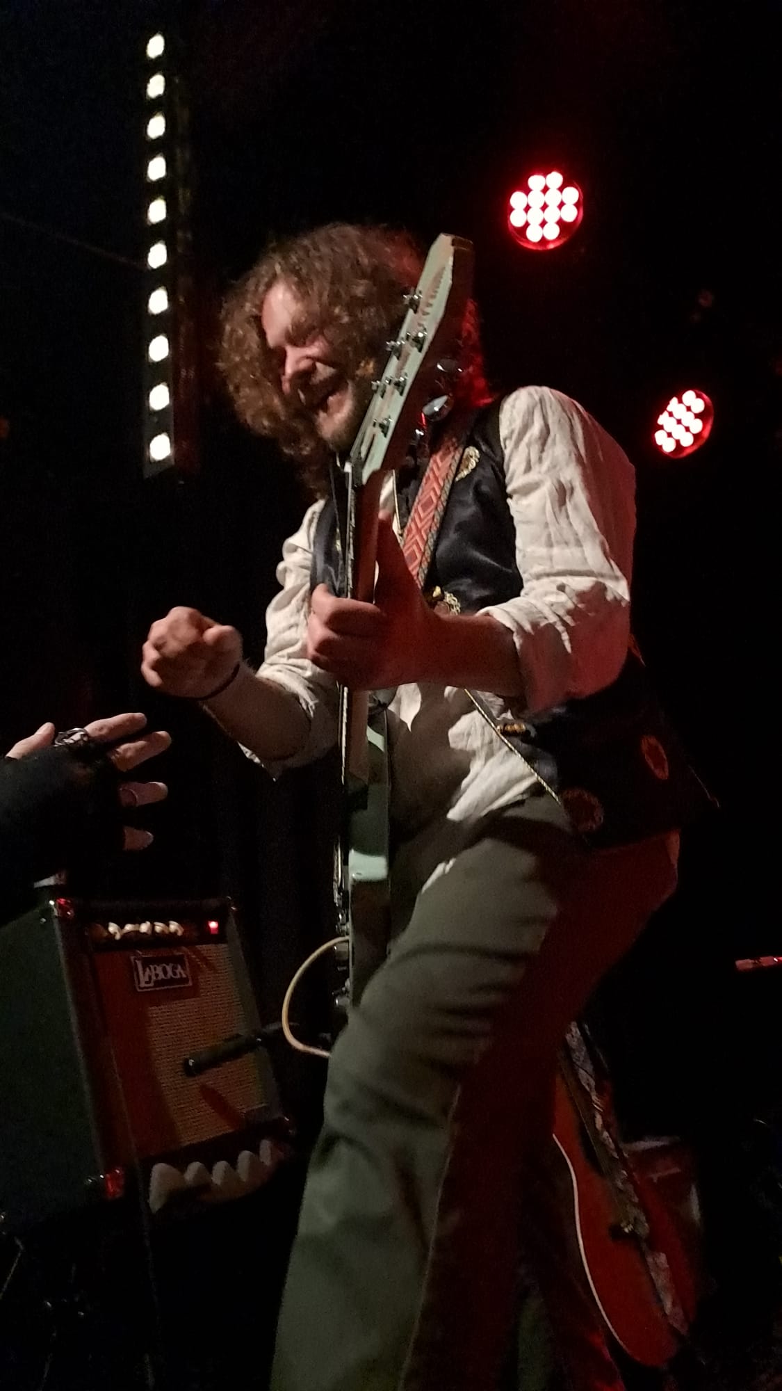 Chango Monks guitarist playing close to the audience